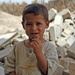 A young Iraqi boy smiles for the camera