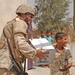 2nd Lt. Justin Otto is handed a box of bottled water