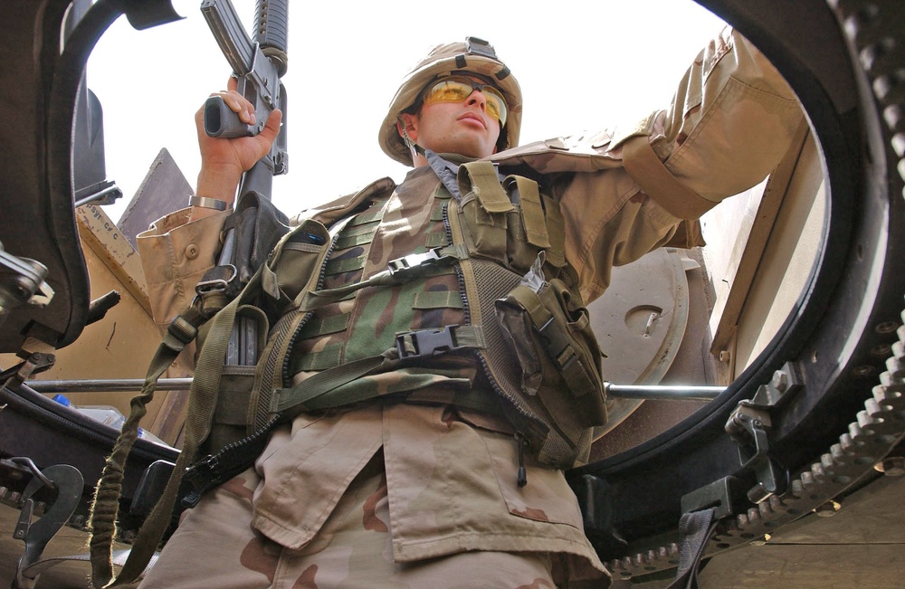 Pfc. Brendon Piper keeps his eye on the vehicles