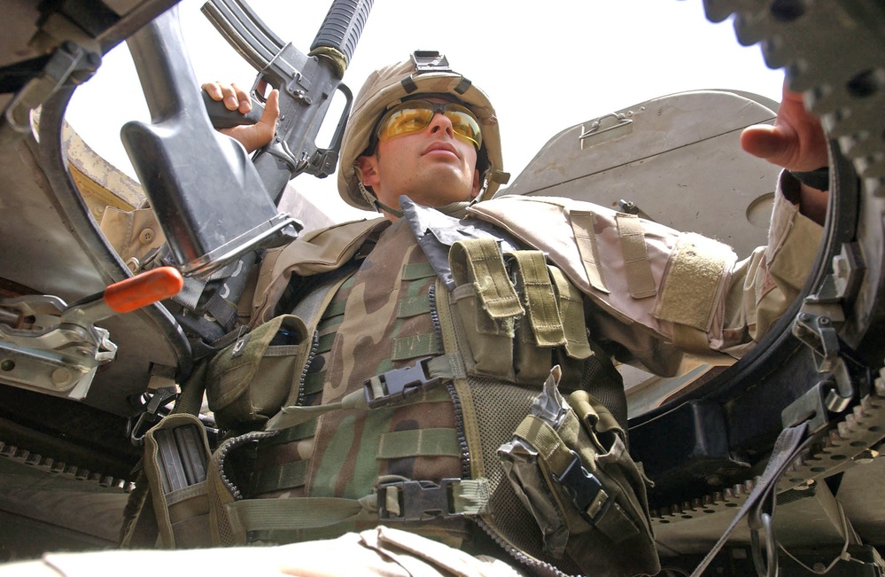 Pfc. Brendon Piper keeps his eye on the vehicles