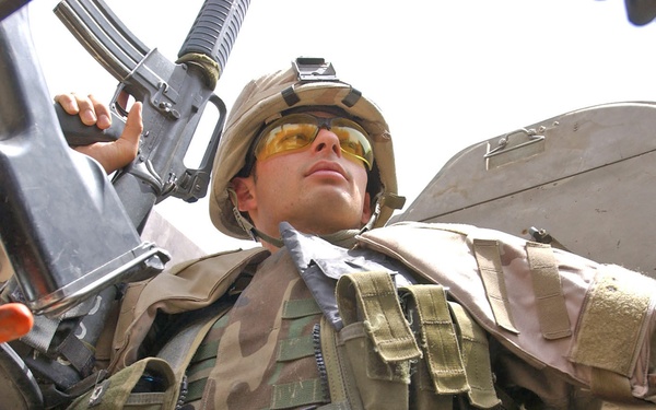 Pfc. Brendon Piper keeps his eye on the vehicles
