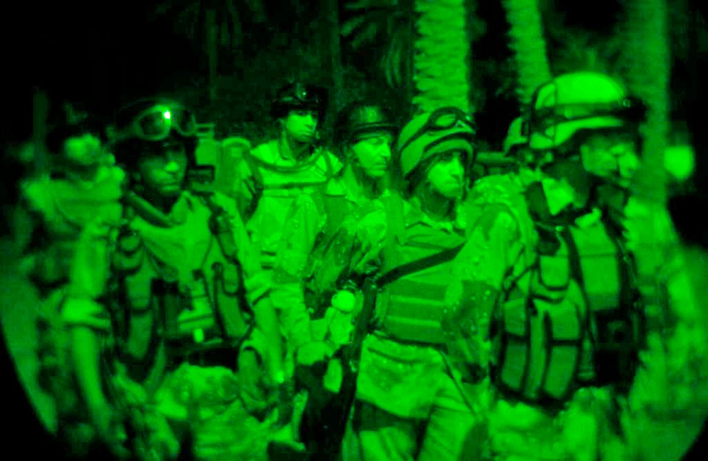 Soldiers suit up and move out on a night raid