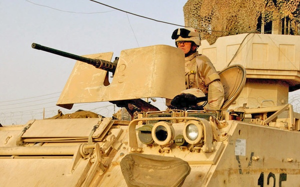 Spc. Nestor Vargas crews the .50-caliber machine gun