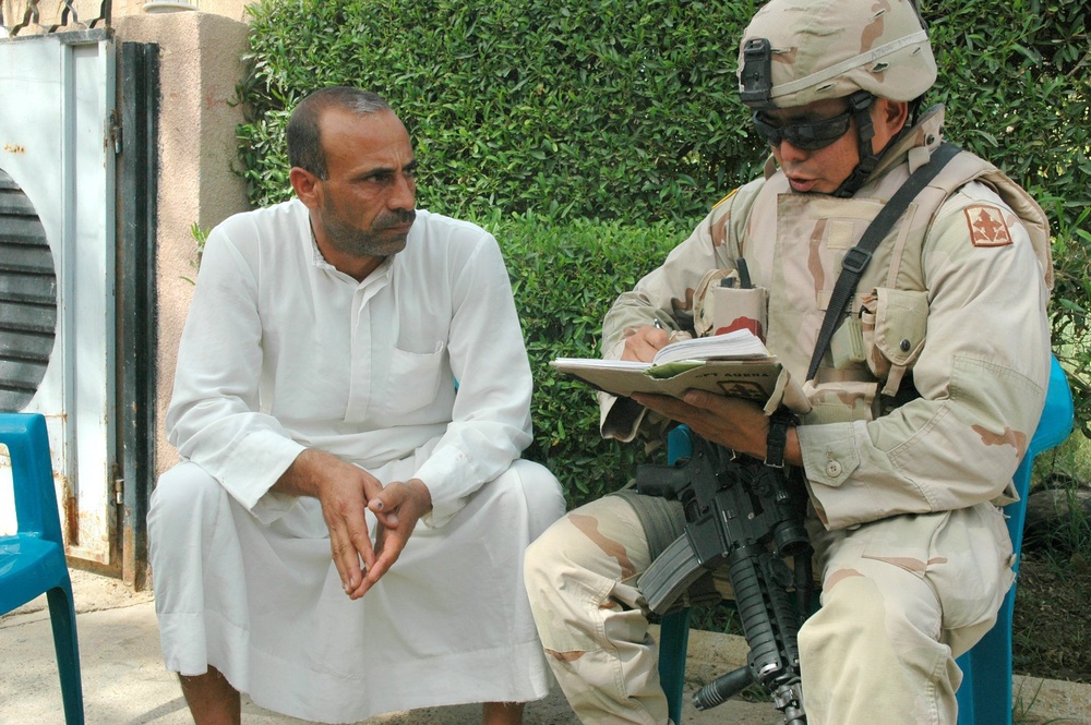 Capt. Paul T. Agena talks with local leaders