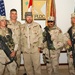 Toby Keith and Major General David Rodriguez pose with soldiers