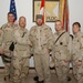 Toby Keith and Major General David Rodriguez pose with soldiers