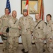 Toby Keith and Major General David Rodriguez pose with soldiers