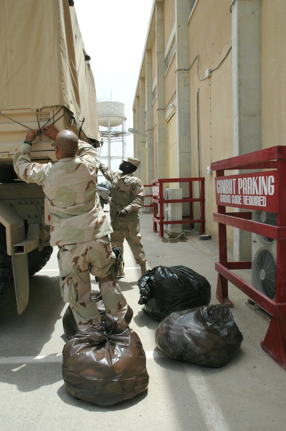 Soldiers load up their truck with exchanged items