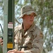 Pfc. Bryan Galloway adjusts a communications antenna