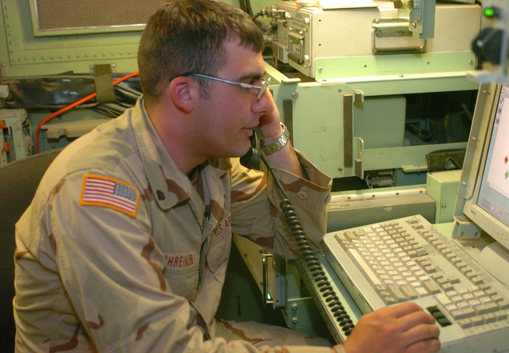 Spc. Eric Schreiner monitors a communication network