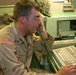 Spc. Eric Schreiner monitors a communication network