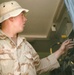 Pfc. Bryan Galloway adjusts a radio system