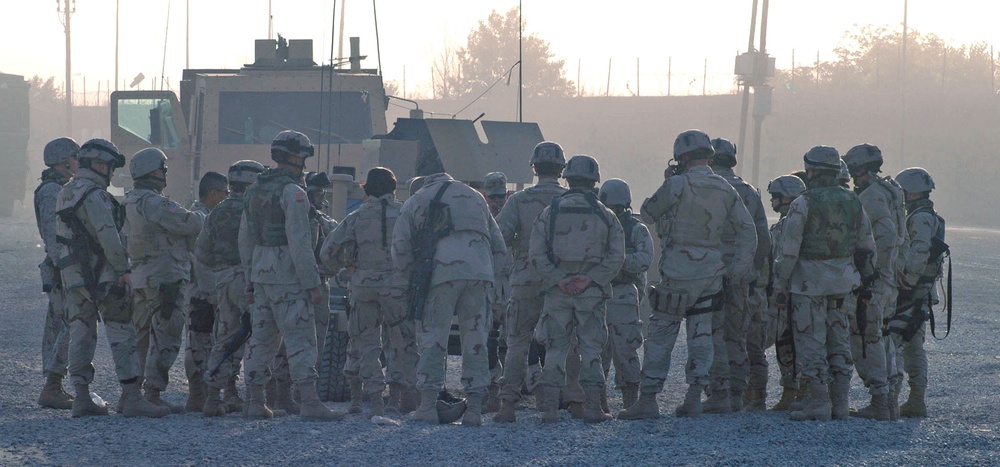 Soldiers go through a safety brief before heading out