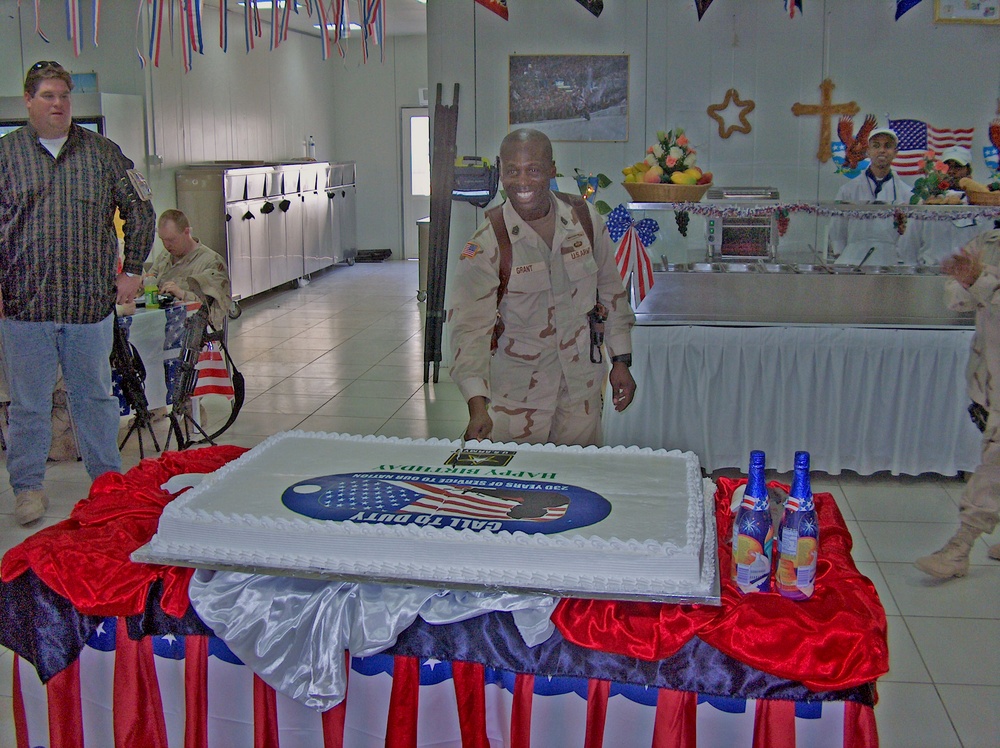 Sgt. Maj. William Grant is all smiles as he cut the cake