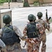 Iraqi Army enter a courtyard during a raid