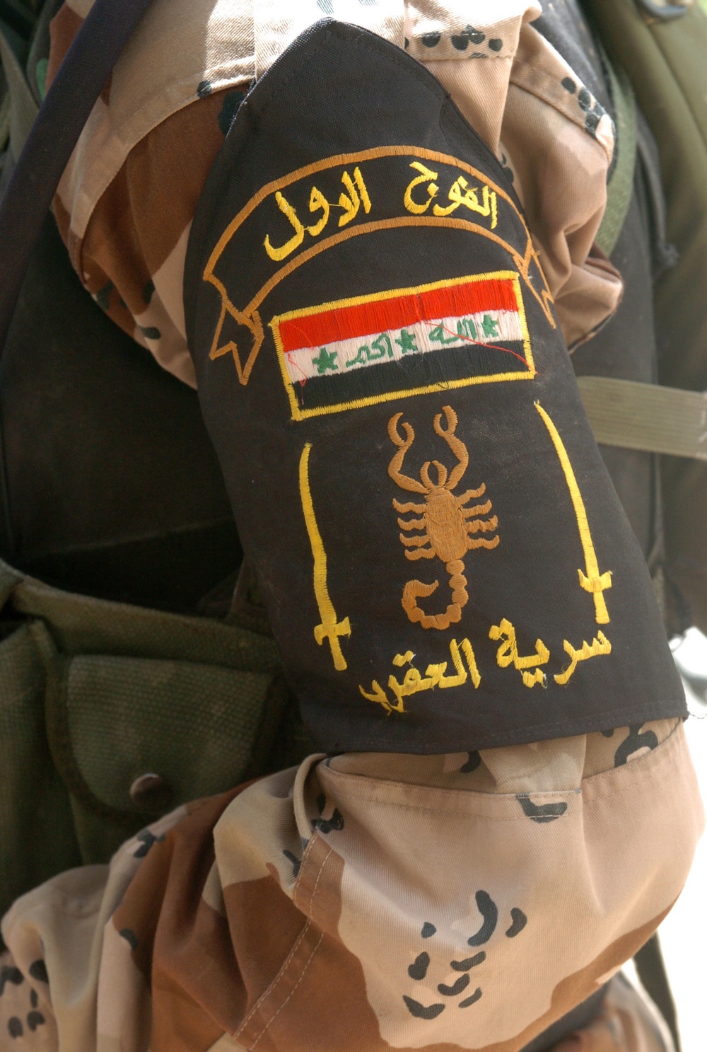 An Iraqi Soldier displays the patch of Scorpion Company