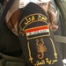 An Iraqi Soldier displays the patch of Scorpion Company