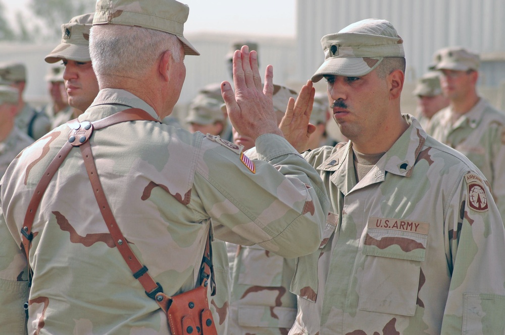 Lt. General Vines returns the salute of Spc. Ordunez