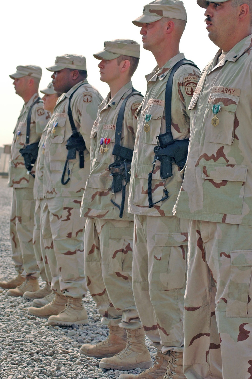 Soldiers stand at parade rest during an awards ceremony