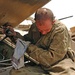 Spc. Seals checks the engine oil on an M2 Bradley