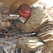 Spc. Seals checks the engine oil on an M2 Bradley