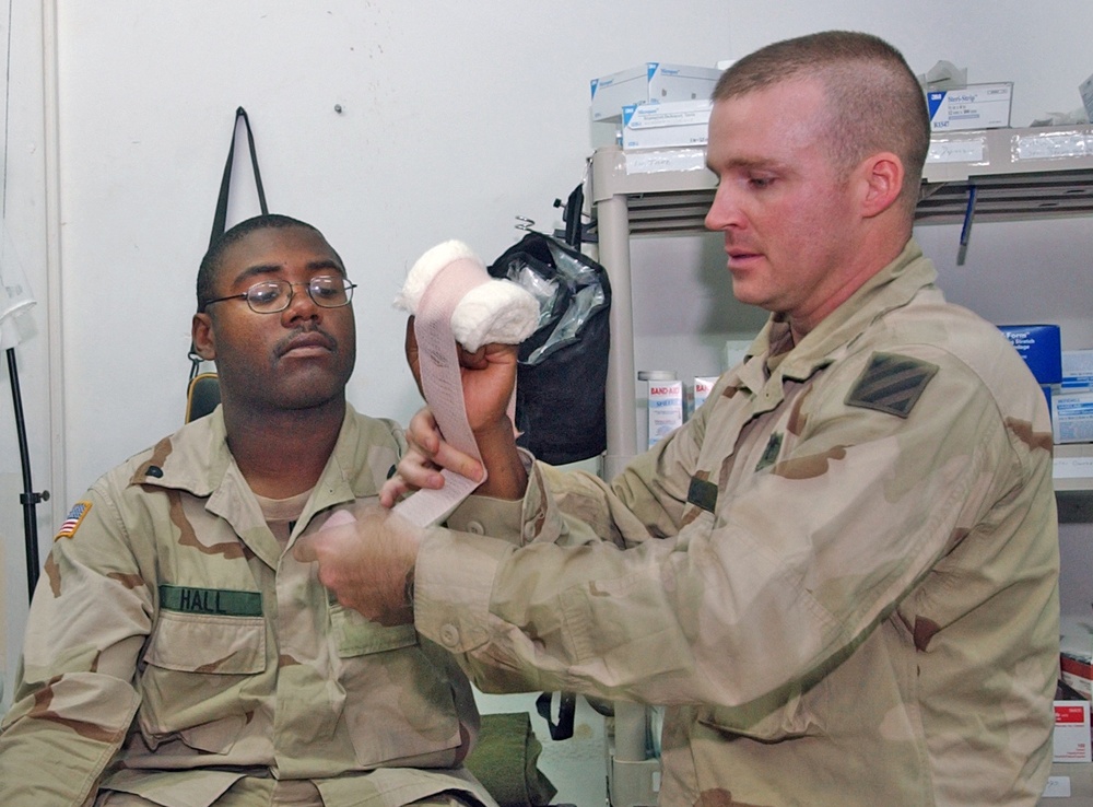 SSgt. James Elmer applies the new Hemcon bandage