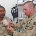 SSgt. James Elmer applies the new Hemcon bandage