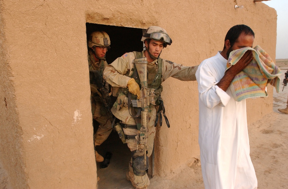 SSgt. Logan Siebert emerges from a room he searched