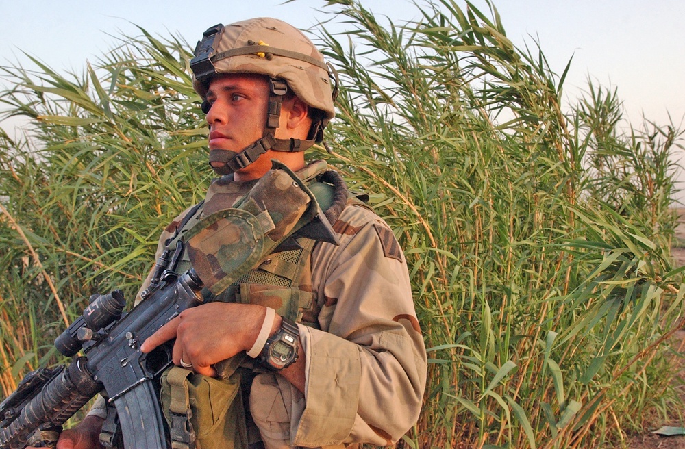 Spc. Curtis Winston watches for insurgents