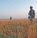 SSgt. Fritz Autenrieth leads Soldiers across a field