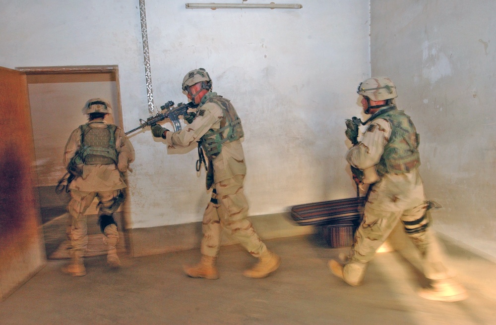 Scout Soldiers rush to enter and secure rooms in a house