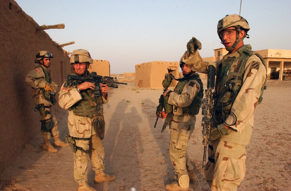 SSgt. Fritz Autenrieth instructs the rest of his team