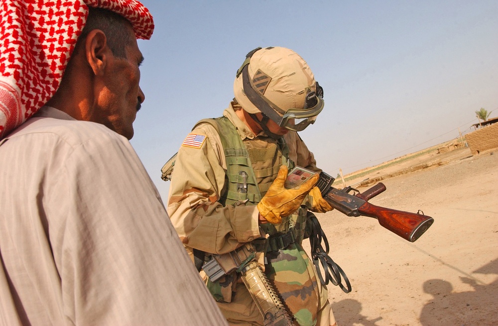 Staff Sgt. Logan Siebert checks the serial number