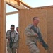 Soldiers practices enter the door of a mock home