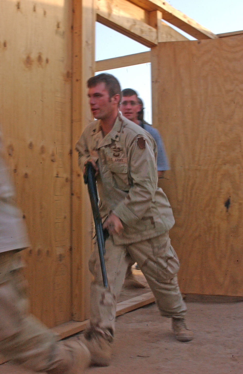 Sgt. Pete Pinnel enters the door of a mock home