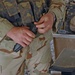 A soldier loads his magazine in preparation