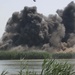 Debris flies into the air after a 500 pound bomb dropped