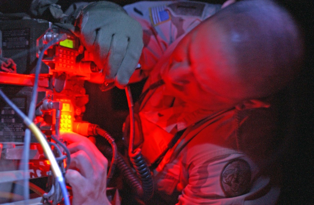 SFC Mark Boley does a radio check by red-light