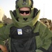 Staff Sgt. Dave Baker dons an EOD8 bomb suit