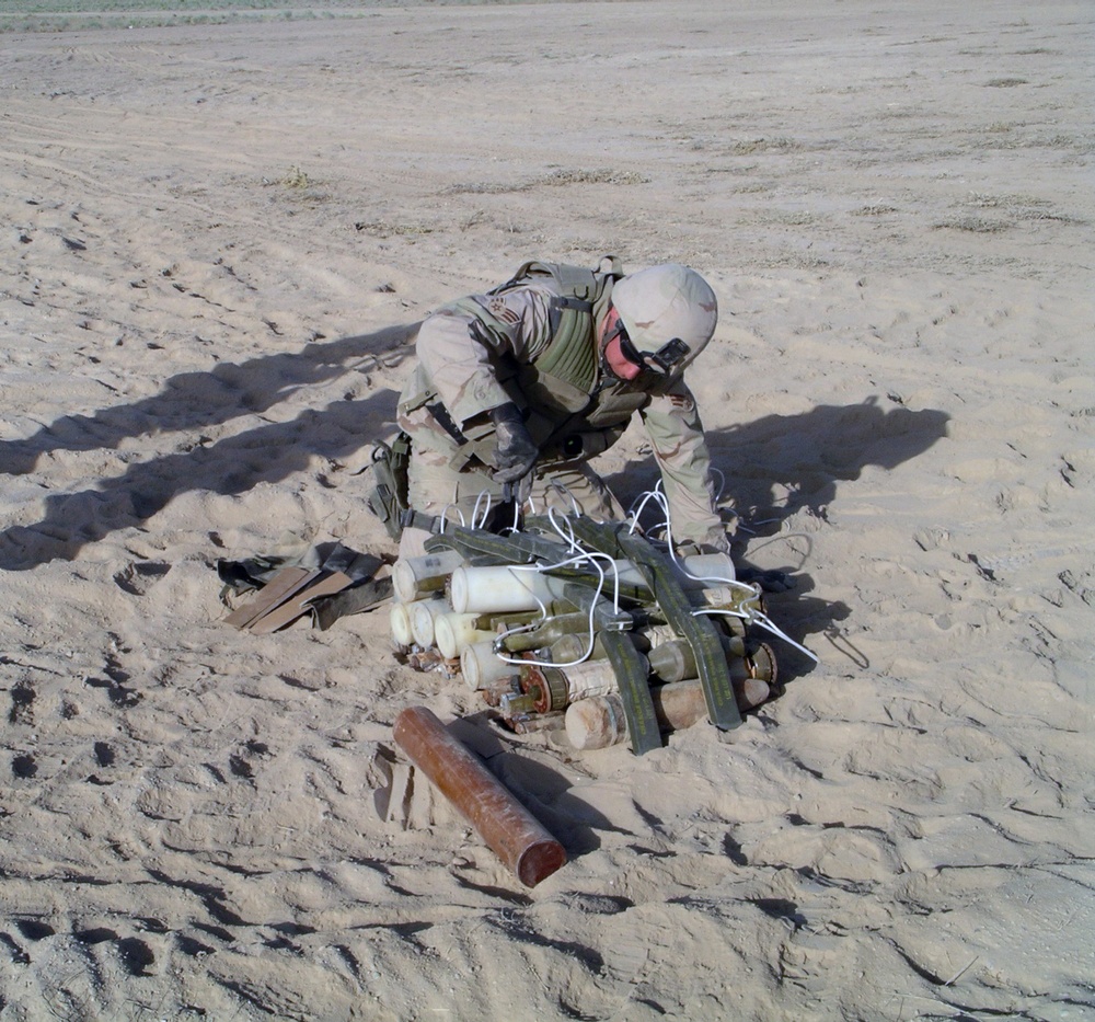 Senior Airman Benbrooks places C4 explosives on a pile