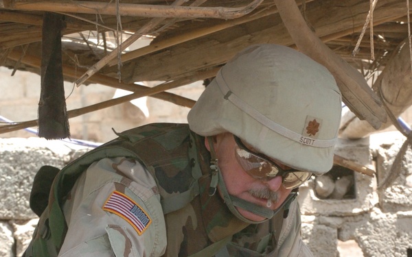 Major Scott vaccinates a water buffalo against worms