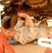 Sgt. Arthur Coogan makes repairs on a company vehicle