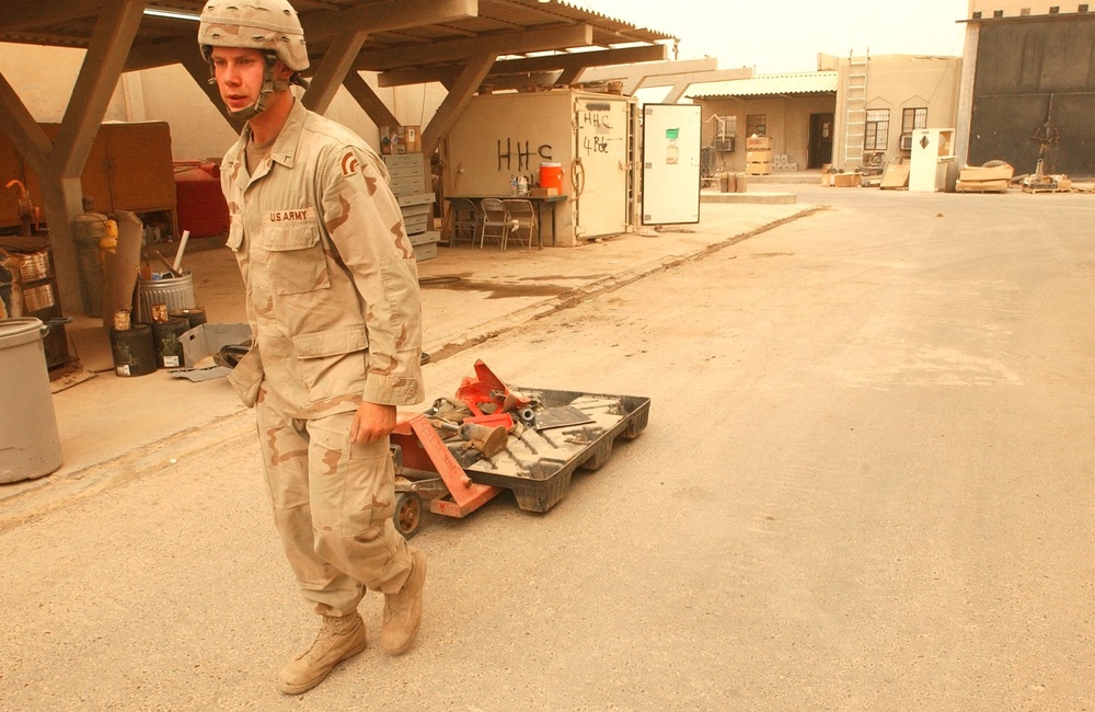 Pv2 Kenneth Geib pulls a skid lift during a routine clean-up