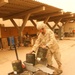 Pv2 Kenneth Geib loads a skid lift during a routine clean-up