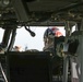 CW2 James Gisclair gets strapped into his UH-60