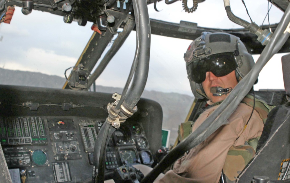 CW2 James Gisclair looks back while flying