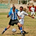 Iraqi and US Soldiers have a friendly game of soccer.
