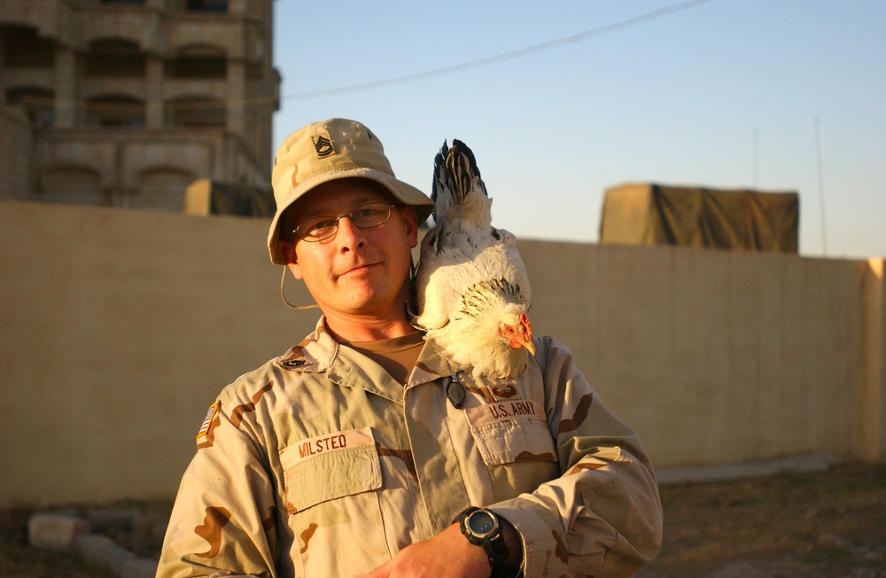 SFC Lance Milsted with a chicken