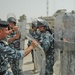A instructor pulls on the front of the shield demonstrating