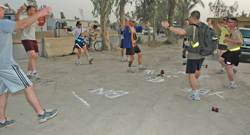 Lt. David Dixon leads the Lost Lake hashers in stretches